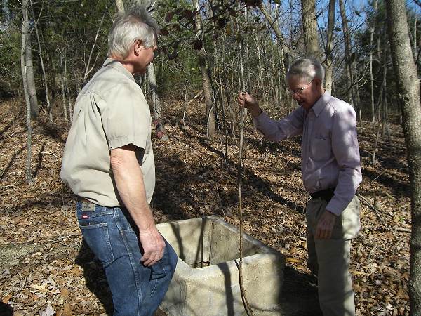 44 Glen Anderson and Roy Sone examining Cistern