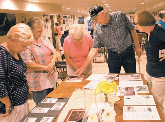 57 Orville Keeth of Iberia shows some photos from Korea