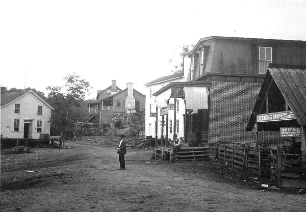 08 Hauenstein's Store on Left - Tom Robinson's Store on Right - White Building Daniel Cummings Store