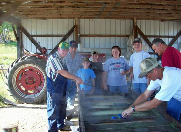 16g John Pendleton and Family making Molasses