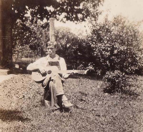 34 Robert Stillwell playing Guitar and Harmonica